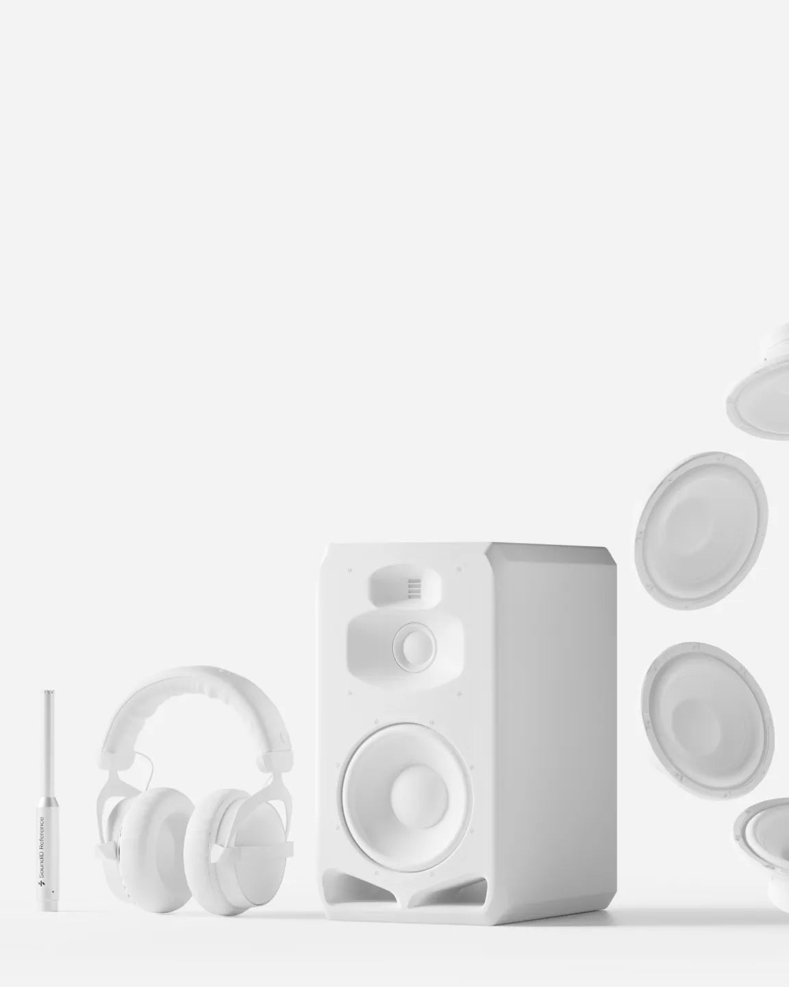 Minimalist white studio setup featuring a large nearfield monitor speaker, closed-back headphones, and a slim measurement microphone against a light background.